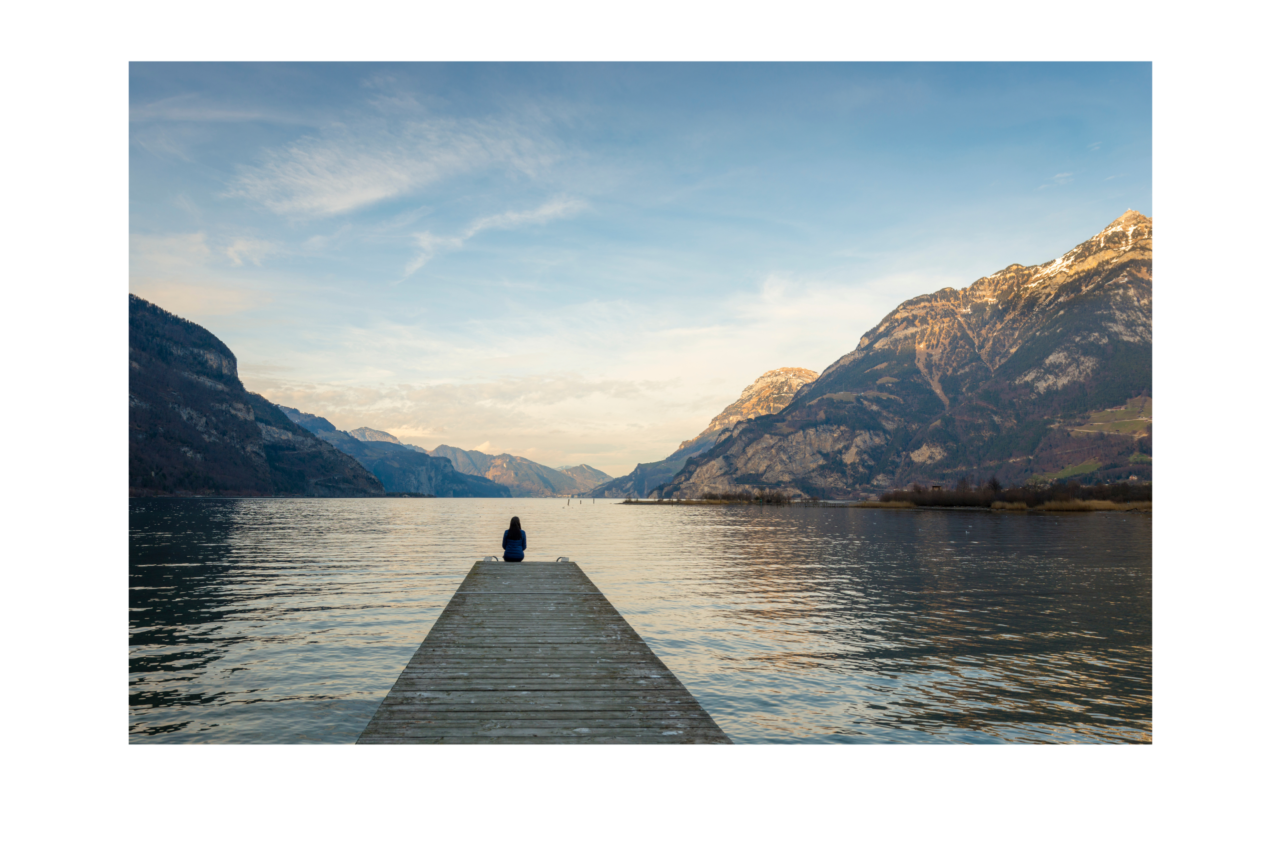 Human close to water and mounatins